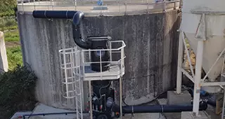 Exterior view of an Aquilair bio with pond