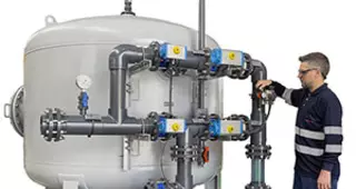 Man working in front of a Filtraflo unit